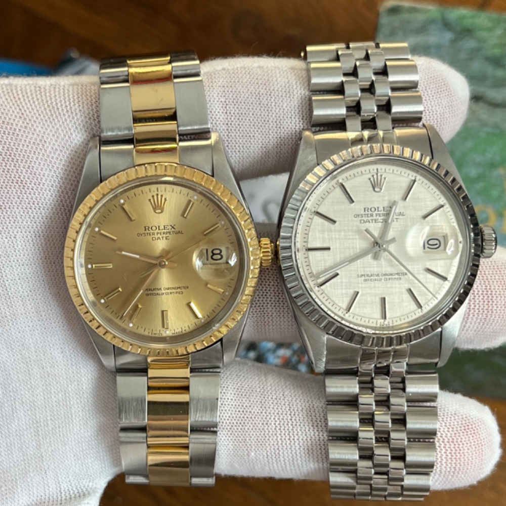 Two Rolex timepieces presented on a gloved hand